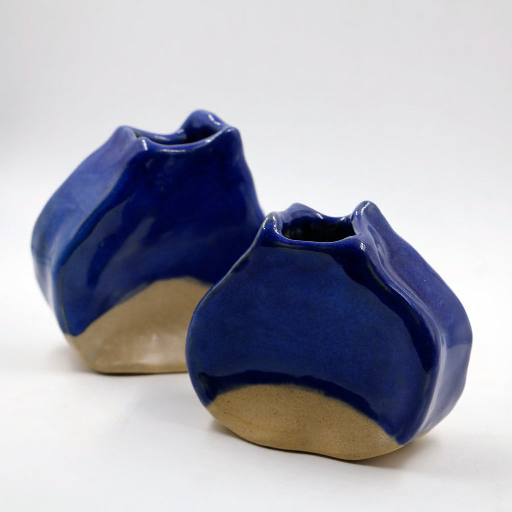 Two small ceramic abstract shaped vases.